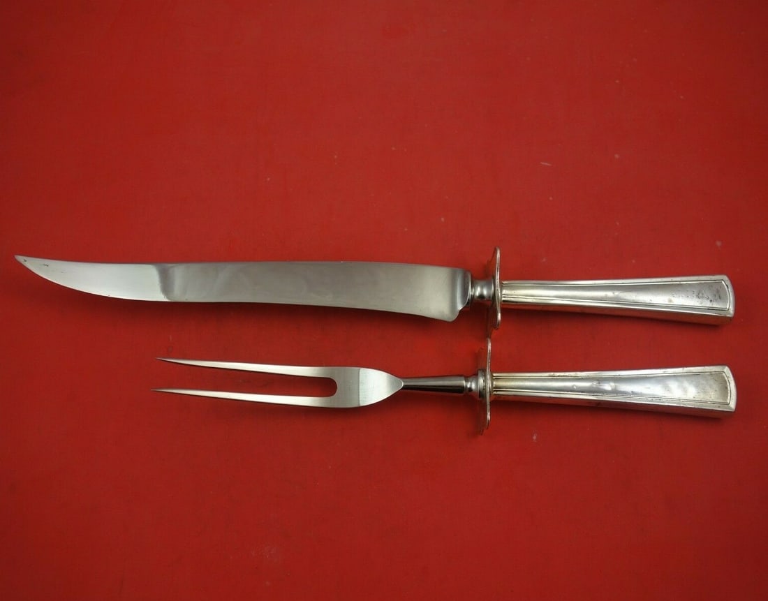 Virginia Pattern Dominick & Haff Sterling Silver Carving Set 2pc: Virginia Pattern Dominick & Haff Sterling Silver Carving Set 2pc Experience the elegance of the Virginia pattern with this exquisite 2-piece roast carving set by Dominick & Haff. Crafted from sterling