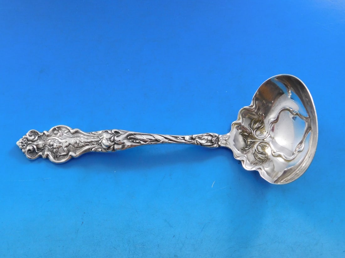 Wallace Irian Art Nouveau Sterling Silver Gravy Ladle 7 1/8": Wallace Irian Art Nouveau Sterling Silver Gravy Ladle 7 1/8" This exquisite gravy ladle is part of the Irian pattern by Wallace, showcasing the elegance of Art Nouveau design. Crafted from high-qualit