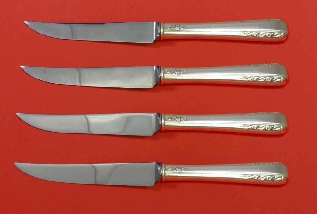 International Sterling Silver Courtship Steak Knife Set 4pc Custom: International Sterling Silver Courtship Steak Knife Set 4pc Custom Enhance your dining experience with this exquisite 4-piece steak knife set from the Courtship pattern by International Sterling. Each
