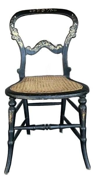 Vintage Boho Chair with Mother of Pearl Inlay and Cane Seat: Vintage Boho Chair with Mother of Pearl Inlay and Cane Seat Embrace vintage charm with this exquisite accent chair featuring intricate mother-of-pearl inlay against a deep black lacquered finish, craf