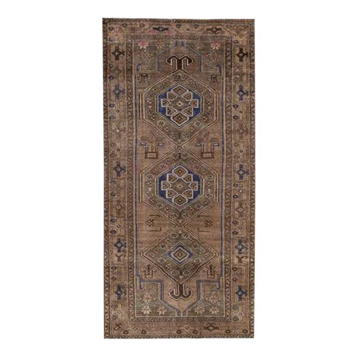 Vintage Handmade Brown Geometric Wool Rug 4'4 x 9'3: Vintage Handmade Brown Geometric Wool Rug 4'4 x 9'3 This stunning vintage handmade wool rug showcases a beautiful shabby chic aesthetic. Featuring a rich brown field adorned with navy blue accents,