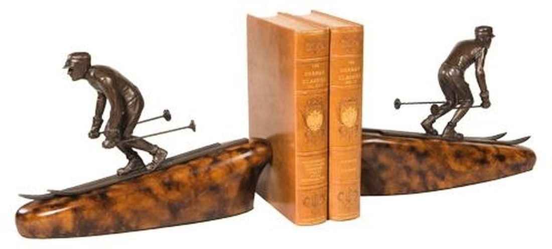Lodge Style Down Hill Skier Bookends Hand-Cast Resin Almond Finish: Lodge Style Down Hill Skier Bookends Hand-Cast Resin Almond Finish This item is made at time of order. Please allow 42 to 70 days for production. Enhance your lodge decor with these charming Down Hill