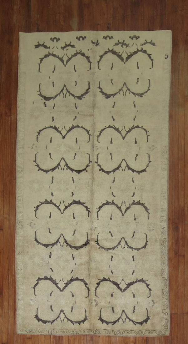 4' 10" x 9' 2" Mid Century Konya Turkish Rug: 4' 10" x 9' 2" Mid Century Konya Turkish Rug Vintage Turkish Konya rug in a neutral color palette. This mid-20th century piece features a decorative repeating motif pattern and is offered in pre-owned