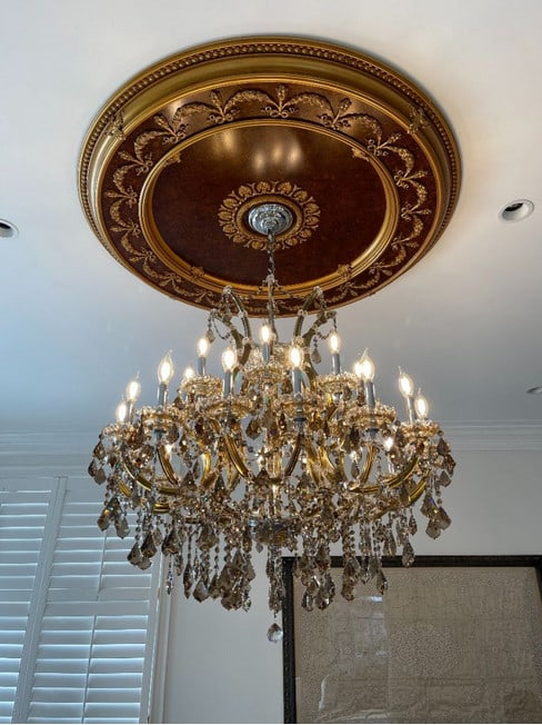 Maria Theresa 36 Inch Chandelier with Golden Teak Asfour Crystals and 25 Lights: Maria Theresa 36 Inch Chandelier with Golden Teak Asfour Crystals and 25 Lights This Maria Theresa chandelier features a striking golden teak frame adorned with Asfour crystals, offering an elegant li