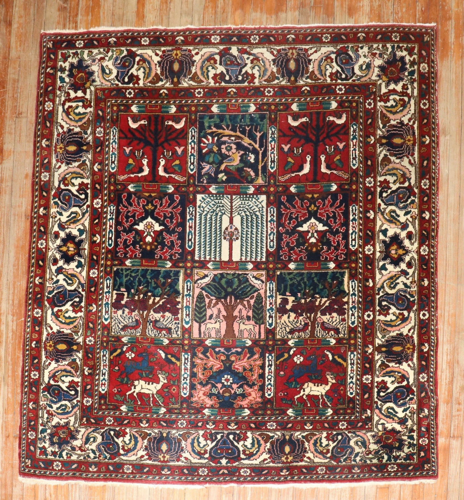 6' 6" x 6' 11" Persian Bakhtiari square rug pictorial garden design: 6' 6" x 6' 11" Persian Bakhtiari square rug pictorial garden design Vintage Persian Bakhtiari rug featuring a pictorial garden design motif in a square format. This pre-owned piece dates to the 3rd qu