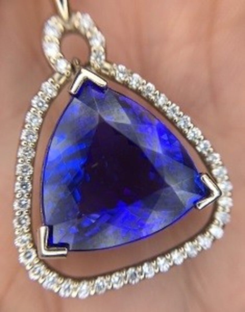 14k White Gold 8.94ct Trillion Tanzanite Pendant with Diamonds: 14k White Gold 8.94ct Trillion Tanzanite Pendant with Diamonds This stunning 14k white gold pendant showcases an exquisite trillion cut genuine natural tanzanite weighing approximately 8.94 carats, co