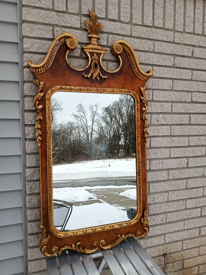 28 by 45 Italian giltwood wall mirror in French style: 28 by 45 Italian giltwood wall mirror in French style Vintage French style mirror made in Italy with a carved wood frame and gold gilt highlights. This pre-owned piece has no visible repairs. Specific