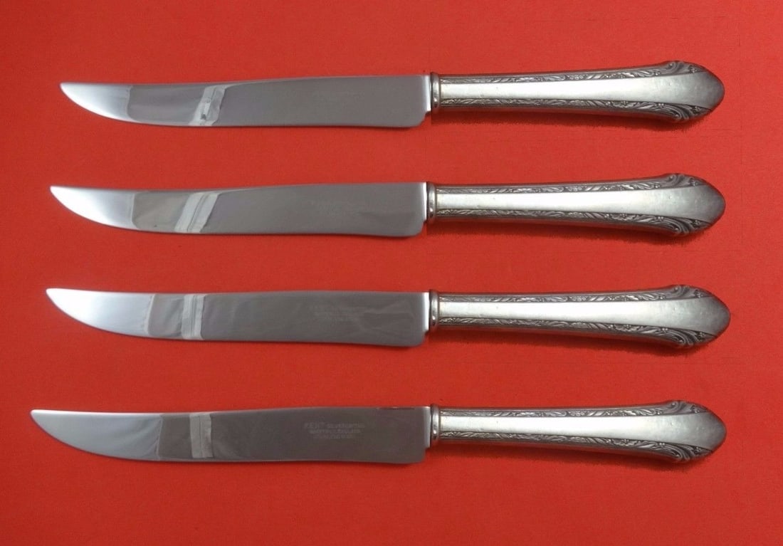 Alvin Chased Romantique Sterling Silver 4-Piece Texas Steak Knife Set: Alvin Chased Romantique Sterling Silver 4-Piece Texas Steak Knife Set This impressive 4-piece steak knife set features the Chased Romantique pattern by Alvin, crafted from sterling silver with hollow 