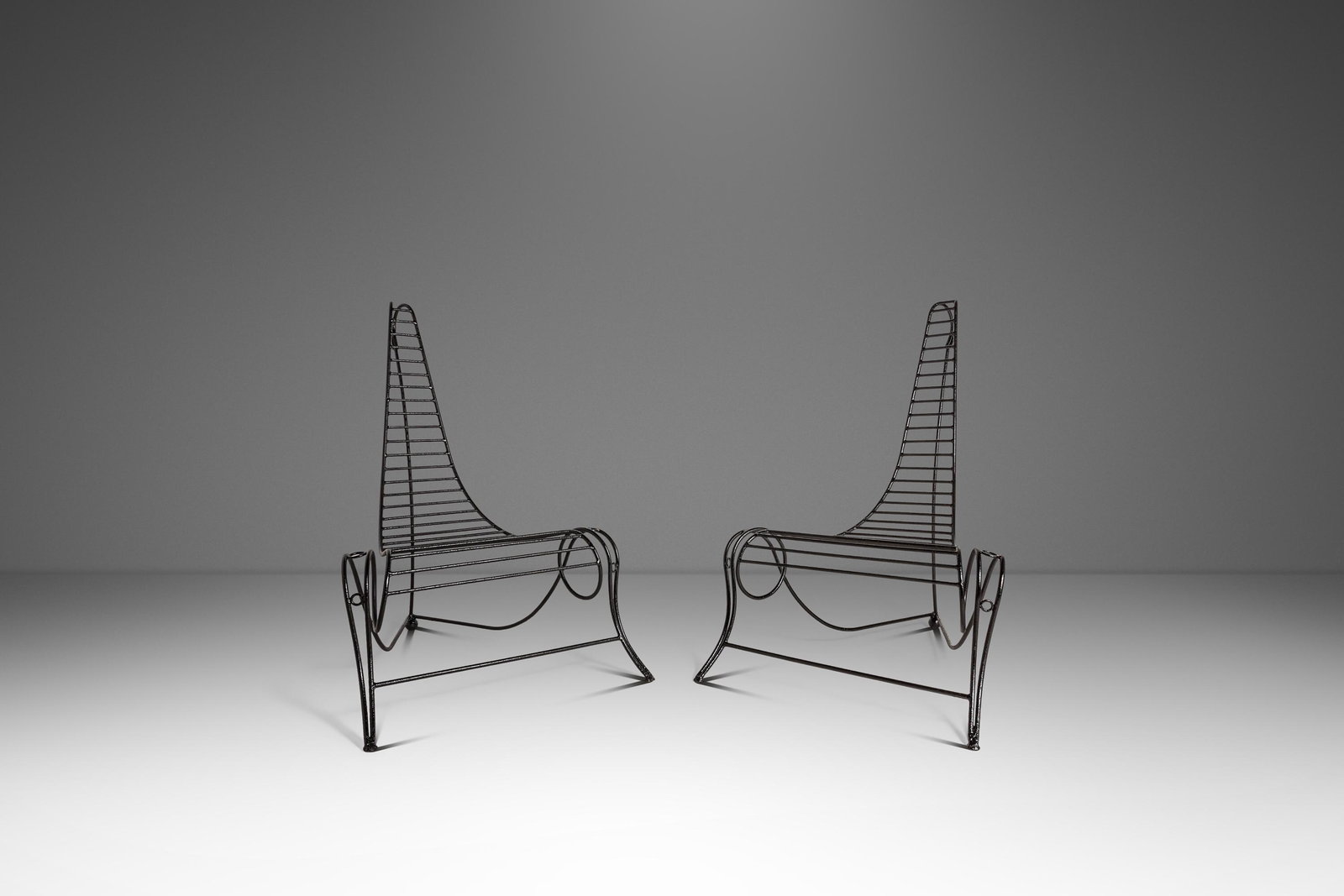 Pair of Oversized Wrought Iron Lounge Chairs in the Manner of Andre Dubreuil: Pair of Oversized Wrought Iron Lounge Chairs in the Manner of Andre Dubreuil Set of two oversized sculptural "Spine Chairs" made in the manner of Andre Dubreuil and crafted in the United States circa 