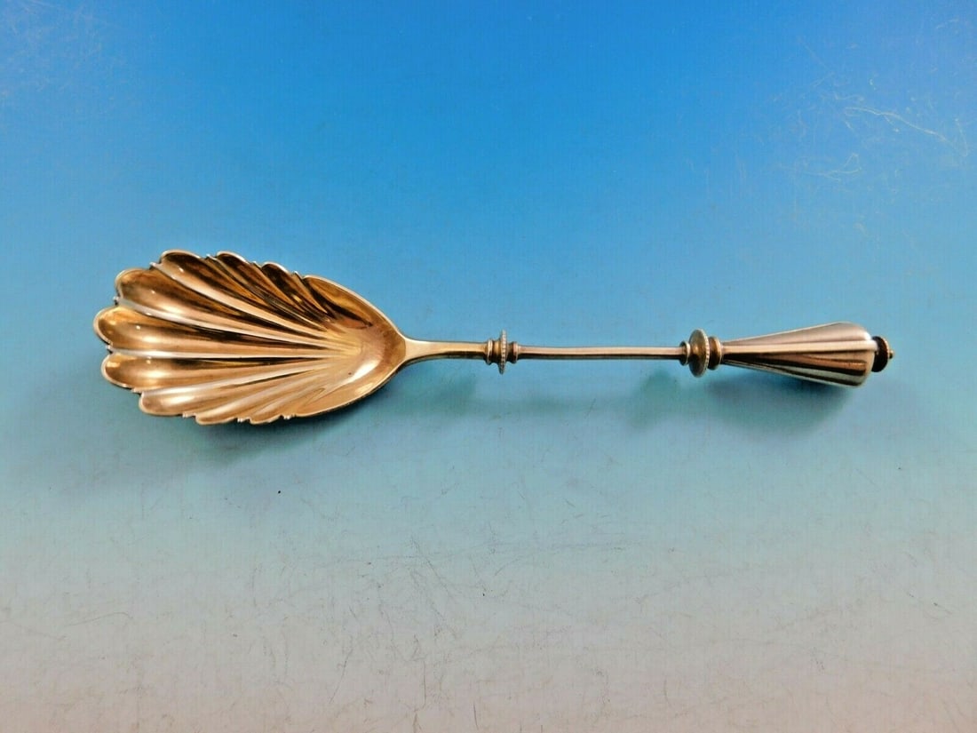 Art Silver 1860-1883 Sterling Silver Sugar Spoon Gold-Washed Shell Bowl: Art Silver 1860-1883 Sterling Silver Sugar Spoon Gold-Washed Shell Bowl This exquisite sterling silver sugar spoon, crafted between 1860 and 1883, showcases a stunning gold-washed shell motif bowl and