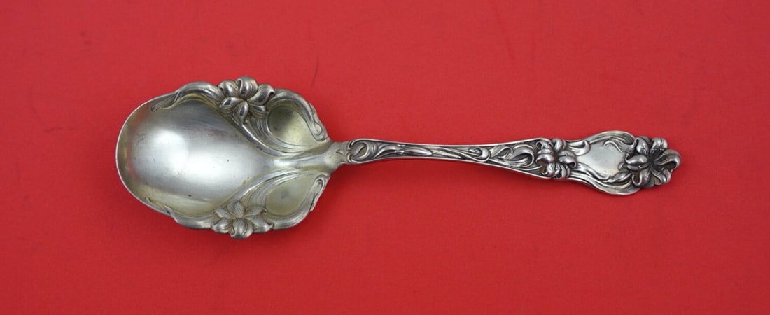 Frank Whiting Sterling Silver Preserve Spoon Lily Pattern 7 1/8": Frank Whiting Sterling Silver Preserve Spoon Lily Pattern 7 1/8" This exquisite preserve spoon features the elegant "Lily" pattern by Frank Whiting, crafted from high-quality sterling silver. Measurin