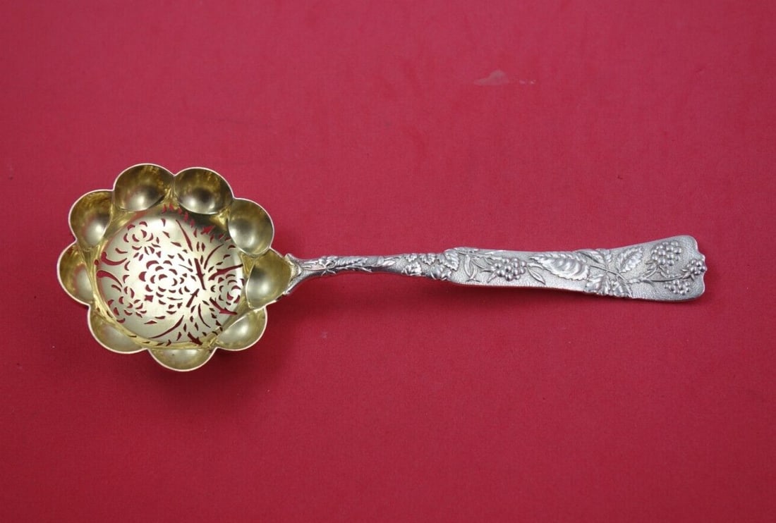Tiffany Co Vine Sterling Silver Sugar Sifter Gold Washed Raspberry Bowl: Tiffany Co Vine Sterling Silver Sugar Sifter Gold Washed Raspberry Bowl A Tiffany & Co. Vine pattern sugar sifter in sterling silver with a round gold-washed lobed bowl pierced with raspberries and a 