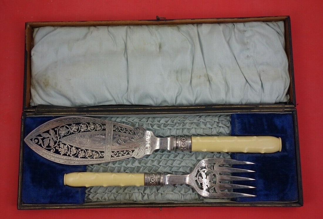 English Sterling Silver Fish Serving Set 2-Piece with Faux Ivory Handles 13": English Sterling Silver Fish Serving Set 2-Piece with Faux Ivory Handles 13" This elegant English Sterling fish serving set features a 2-piece design crafted by various makers. The set includes a fish