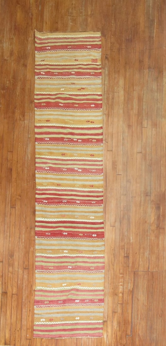2' 8" x 12' 1" Mid 20th Century Turkish Kilim Rug Runner: 2' 8" x 12' 1" Mid 20th Century Turkish Kilim Rug Runner Vintage Turkish kilim runner from the mid-20th century. This pre-owned flatwoven runner offers the character and style of a traditional kilim d
