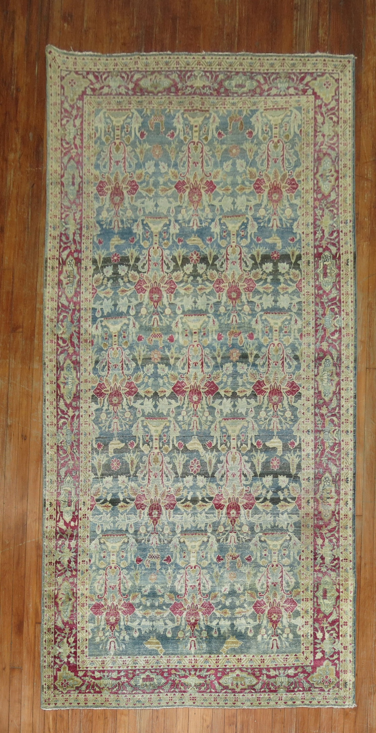 5' x 9' 9" Early 20th Century Indian Kerman Pictorial Rug: 5' x 9' 9" Early 20th Century Indian Kerman Pictorial Rug Early 20th century Indo green and soft red Kerman pictorial rug with a gallery/intermediate format. This pre-owned rectangular area rug featur