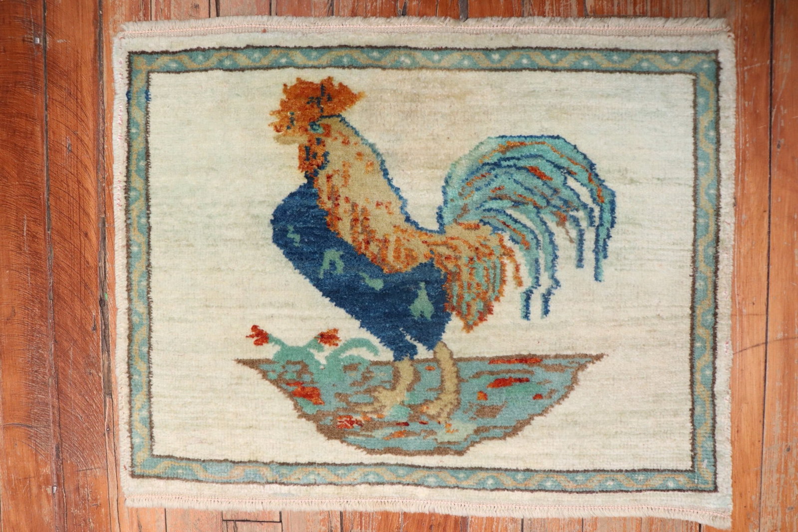 1' 6" x 1' 11" Turkish pictorial rooster mat rug: 1' 6" x 1' 11" Turkish pictorial rooster mat rug Vintage Turkish pictorial mat-size rug featuring a rooster motif on an ivory field. This pre-owned piece is identified as a Sparta type rug and is cate