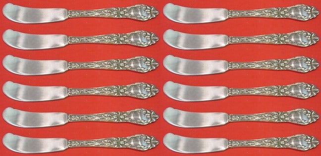 Frank Whiting Lily Sterling Silver Butter Spreader Set of 12 pcs 5 3/4": Frank Whiting Lily Sterling Silver Butter Spreader Set of 12 pcs 5 3/4" Enhance your dining experience with this exquisite set of 12 butter spreaders in the iconic Lily pattern by Frank Whiting. Each 