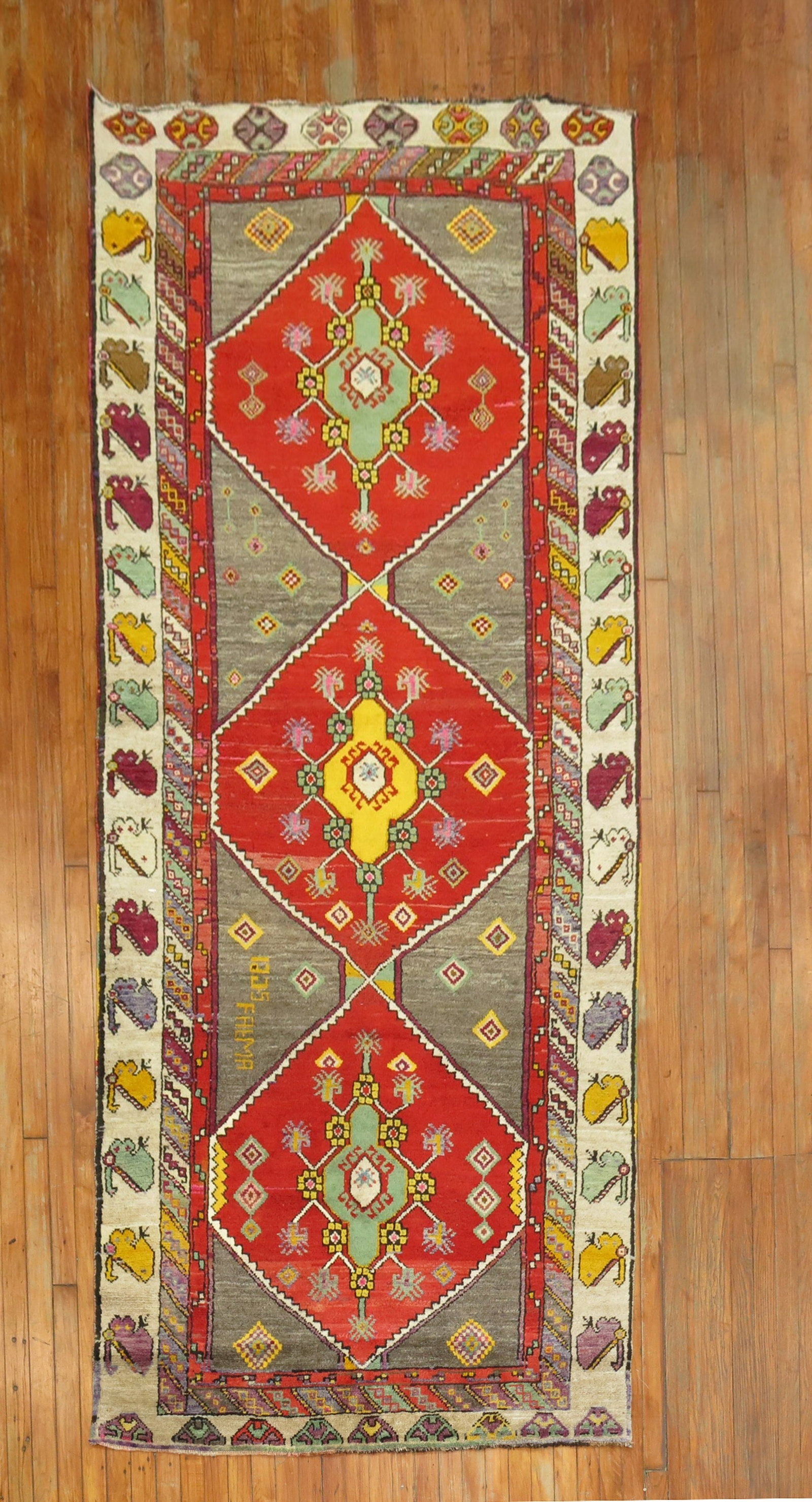 4' 4" x 10' 8" Turkish Kars Anatolian Runner Rug: 4' 4" x 10' 8" Turkish Kars Anatolian Runner Rug Colorful vintage Turkish Kars wide runner from the mid-20th century. This Anatolian rug is a pre-owned piece with a wide runner format and vibrant char