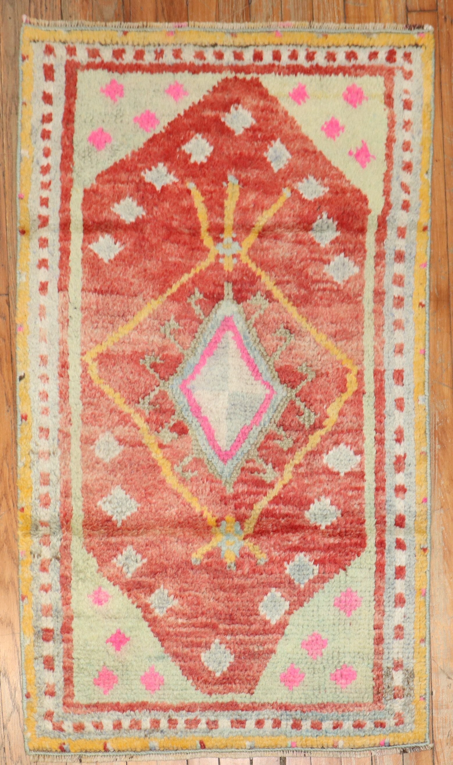 2' 6" x 4' 1" Mid 20th Century Turkish Tulu Rug: 2' 6" x 4' 1" Mid 20th Century Turkish Tulu Rug Vintage Turkish Tulu rug from the mid 20th century. This small pre-owned rug is identified as a Tulu and features a geometric design with a central diam