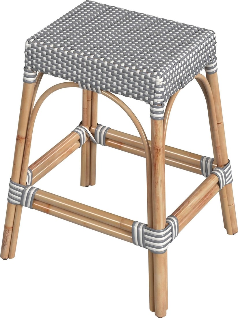 Butler Specialty Coastal Gray Rattan Stool 24.5H 19.5W 17D: Butler Specialty Coastal Gray Rattan Stool 24.5H 19.5W 17D Introducing the Elegant Gray Rattan Stool, a stylish addition to your coastal decor. Crafted with a natural rattan frame and a chic white fin