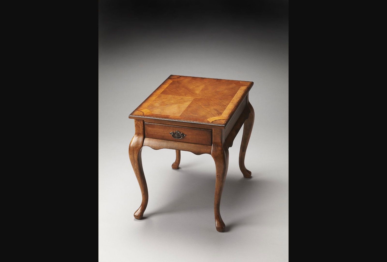 Butler Queen Anne Olive Ash End Table with Cherry Veneer: Butler Queen Anne Olive Ash End Table with Cherry Veneer Introducing the Timeless Olive Ash End Table, a beautifully crafted piece that embodies the charm of antique and vintage styles. This rectangul