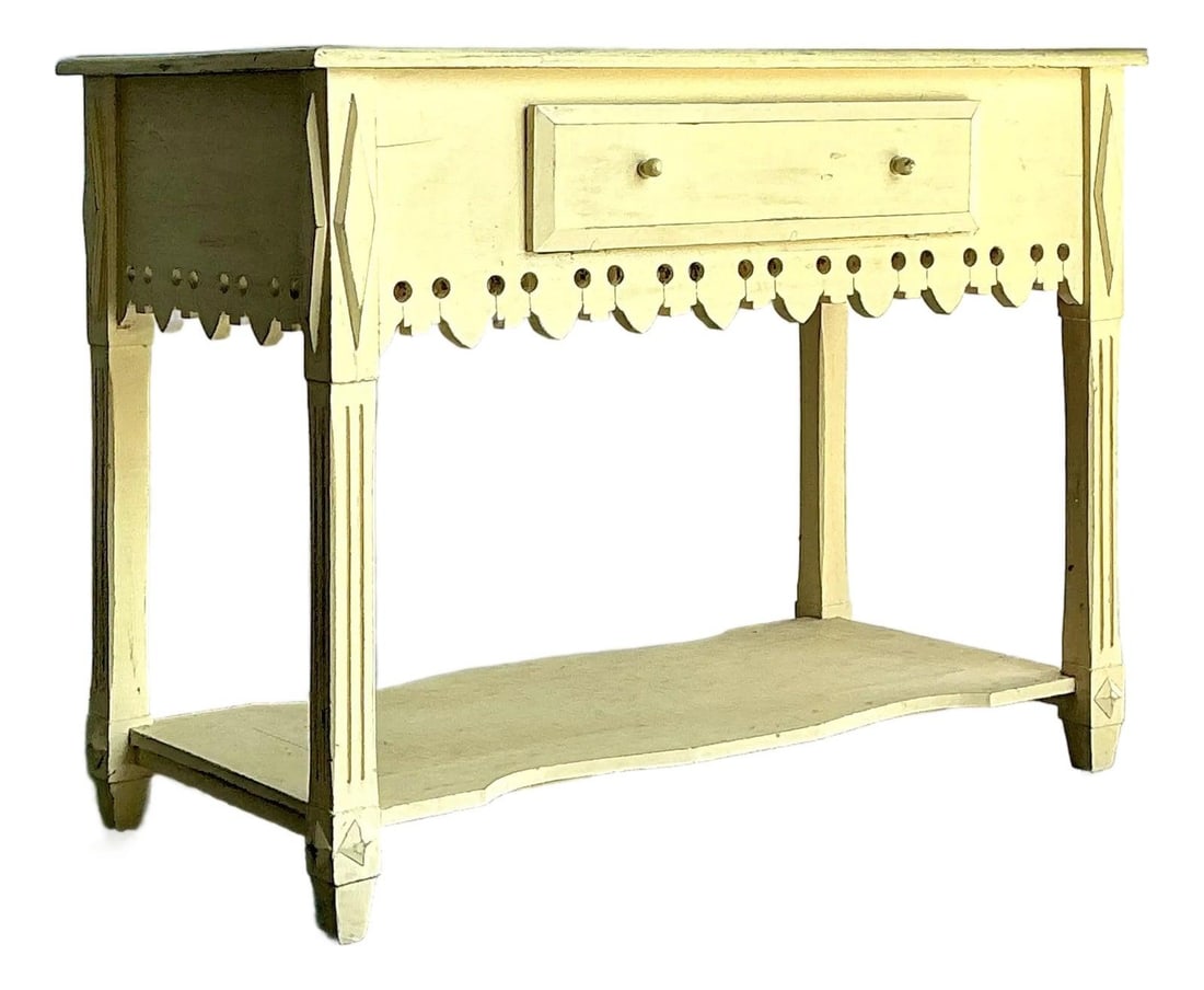 French Country Wood Console with Drop Front Storage: French Country Wood Console with Drop Front Storage This vintage sideboard showcases classic French Country style with distinctive "gingerbread" architectural details. It features a whimsical scallope
