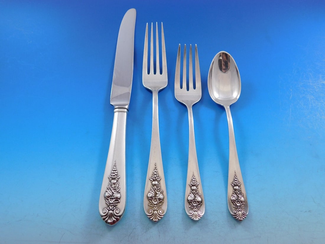 Lunt Sterling Silver Pendant of Fruit 4-Piece Place Setting: Lunt Sterling Silver Pendant of Fruit 4-Piece Place Setting This exquisite 4-piece place setting features the elegant Pendant of Fruit pattern by Lunt. Crafted from high-quality sterling silver, this 