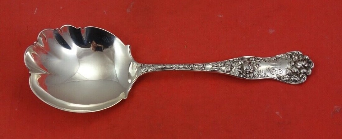 Shiebler American Beauty Sterling Silver Berry Spoon 8.5 inches: Shiebler American Beauty Sterling Silver Berry Spoon 8.5 inches This exquisite berry spoon, crafted by Shiebler, showcases the timeless American Beauty pattern. Made of sterling silver, this scalloped