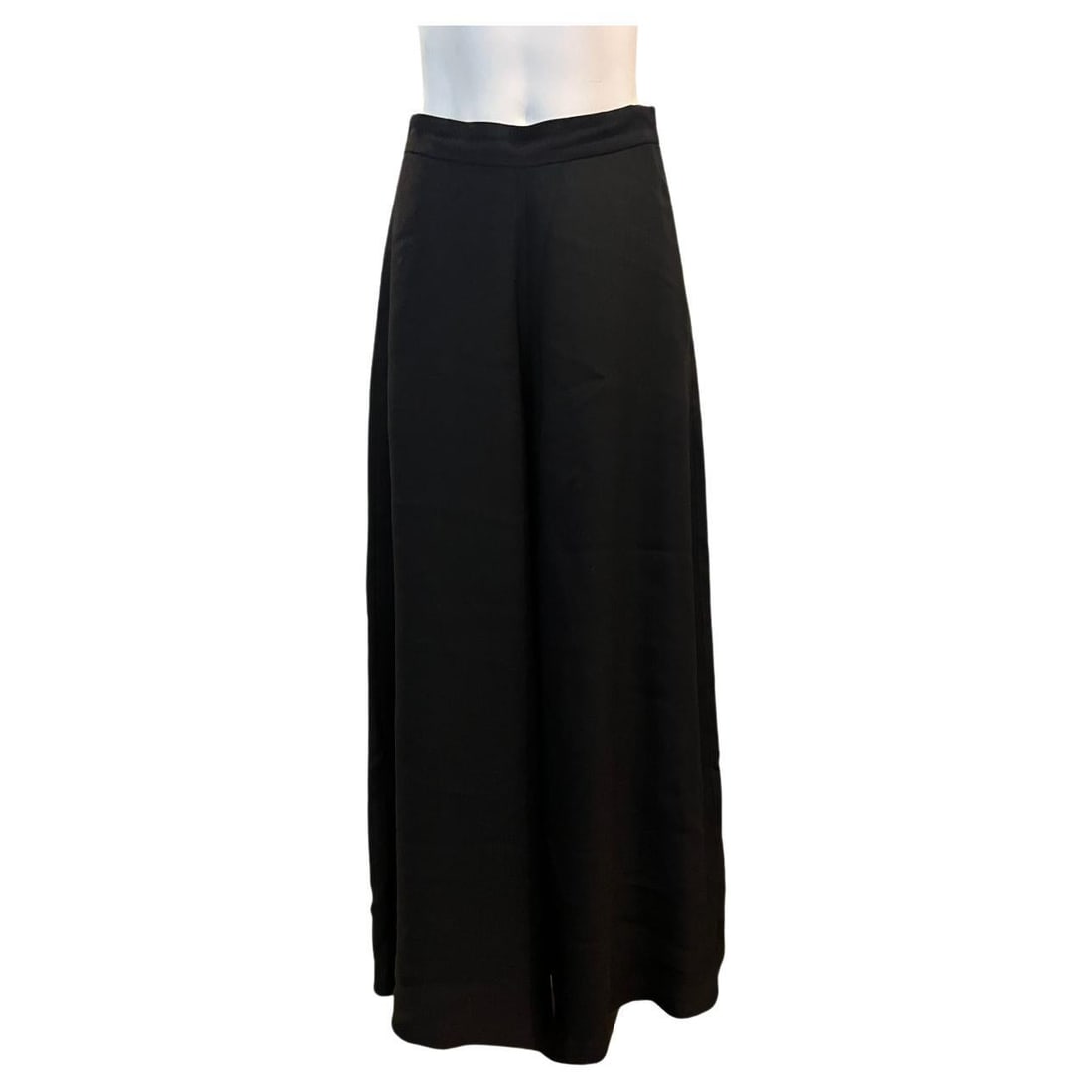 The Row wide leg black pants US size 2: The Row wide leg black pants US size 2 Black pants by The Row featuring a mid-rise silhouette, wide-leg cut, side concealed zip closure, and pockets on each side. Marked size 2 (US). Condition is exce