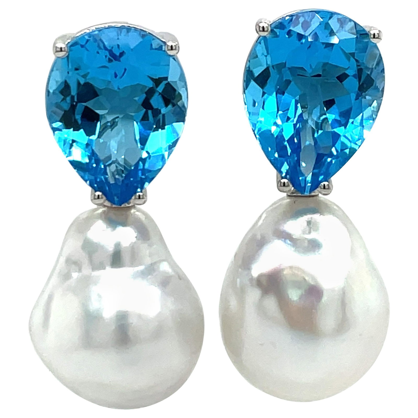 Harbor Diamonds 14K White Gold Topaz Baroque Pearl Drop Earrings 20.79 Carats: Harbor Diamonds 14K White Gold Topaz Baroque Pearl Drop Earrings 20.79 Carats These exquisite 14 Karat White Gold drop earrings showcase a contemporary design, featuring two stunning pear-shaped Blue 