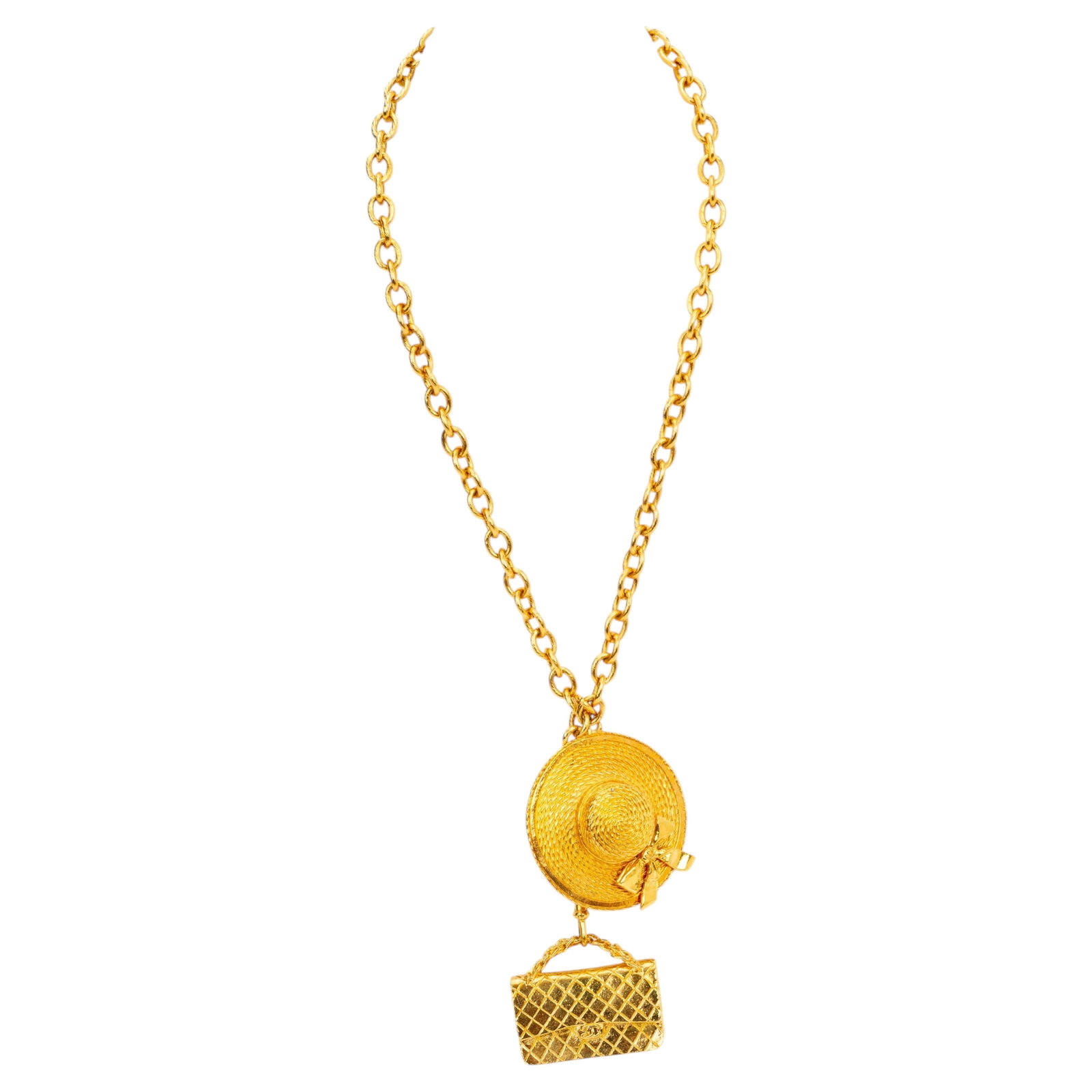 Vintage Chanel Necklace with Hat and Purse Pendants 31 Inch: Vintage Chanel Necklace with Hat and Purse Pendants 31 Inch This vintage Chanel necklace features distinctive hat and purse pendants, showcasing iconic design elements. Crafted from metal, this collec