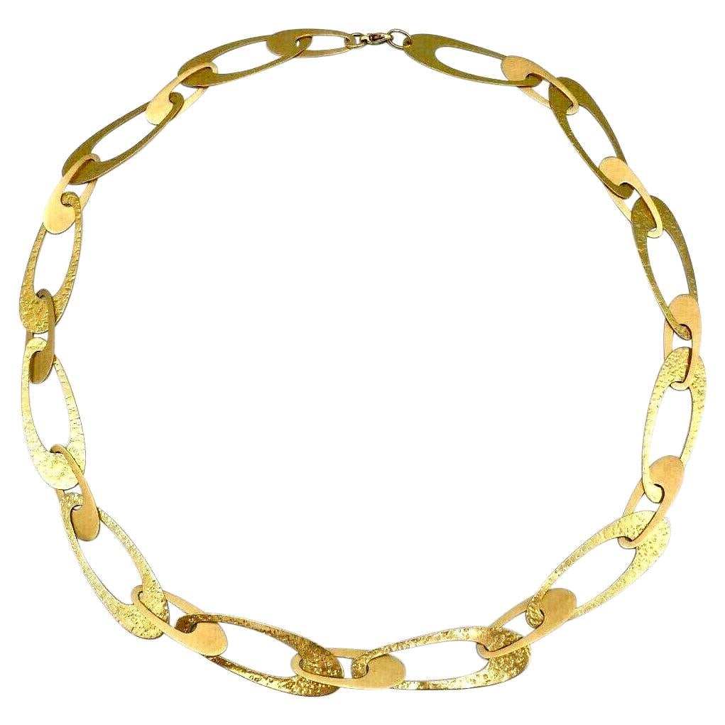 1970s 14k Yellow Gold Hammered Flat Link Necklace 22.5 In: 1970s 14k Yellow Gold Hammered Flat Link Necklace 22.5 In Vintage flat link necklace in 14k yellow gold with a hammered and polished finish. The piece dates to the 1970-1979 period, with a date of man