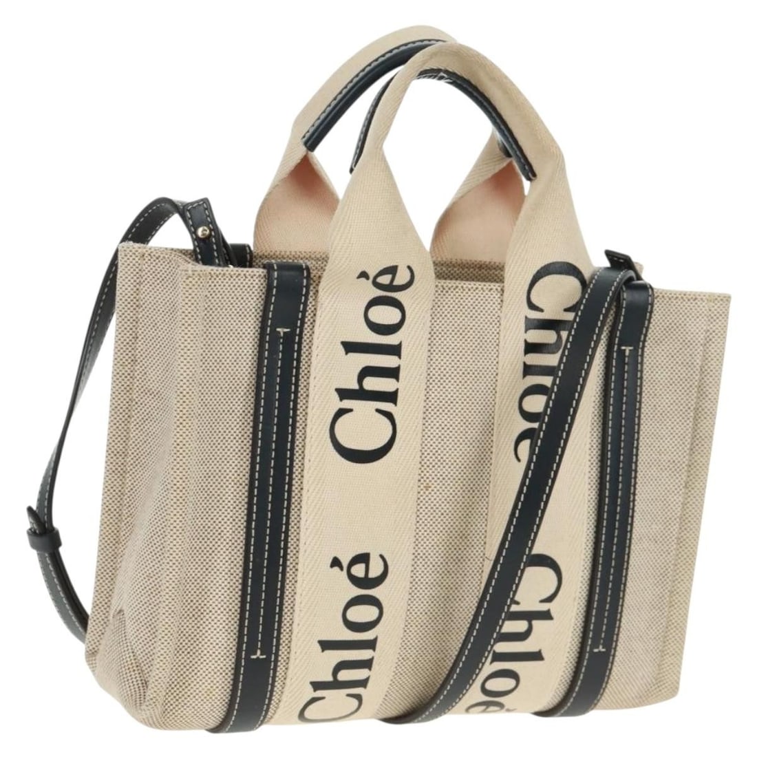 Chloe Woody 2way Canvas Handbag Ivory Gold Made in Italy: Chloe Woody 2way Canvas Handbag Ivory Gold Made in Italy Chloe Woody 2-way handbag in ivory and gold canvas with top handles and a shoulder strap. Made in Italy, this women's bag shows reasonable wear
