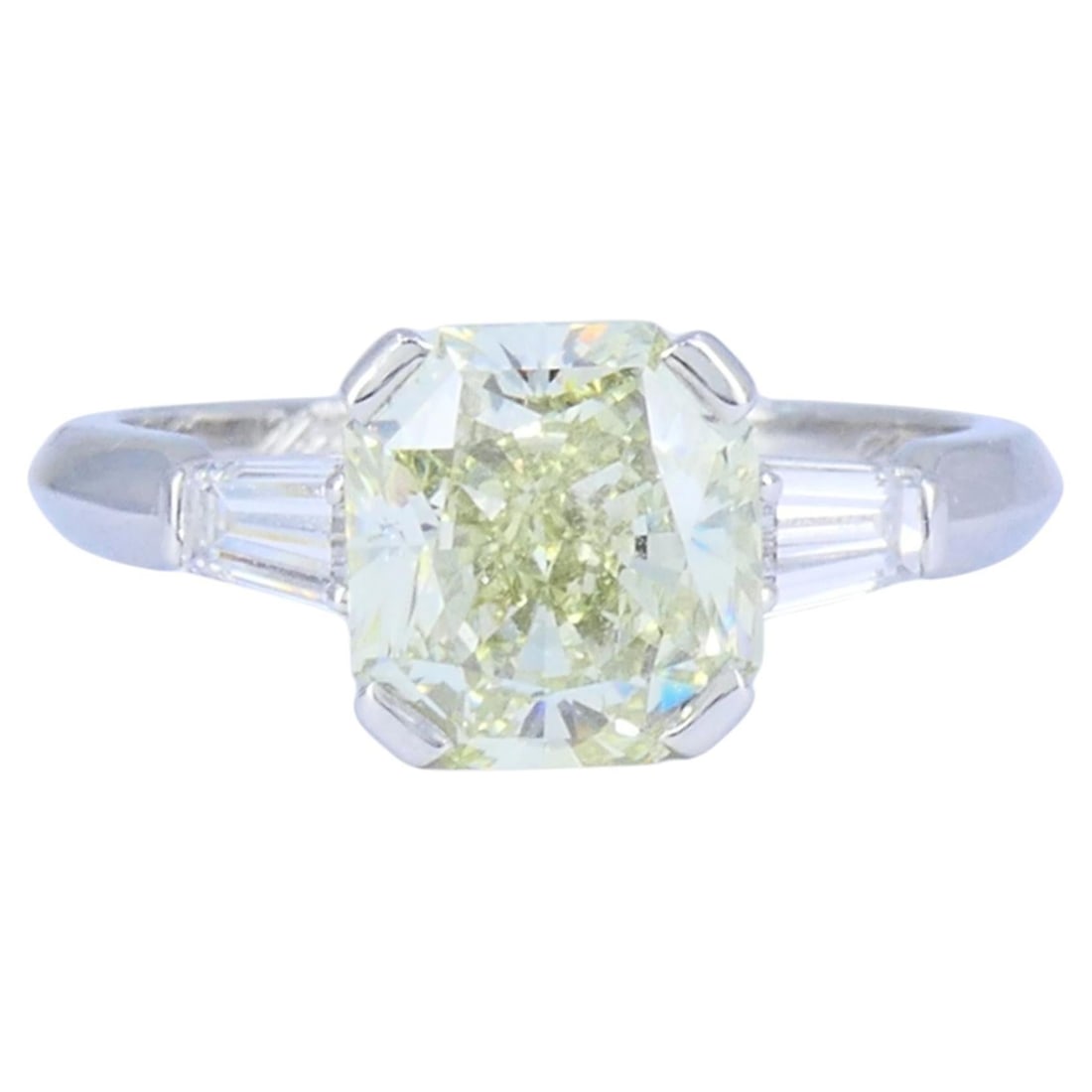 Van Cleef Arpels Platinum 3 Stone Diamond Ring with GIA Report: Van Cleef Arpels Platinum 3 Stone Diamond Ring with GIA Report Platinum three-stone engagement ring with a brilliant cut diamond center stone and tapered baguette diamond side stones. The ring has a p