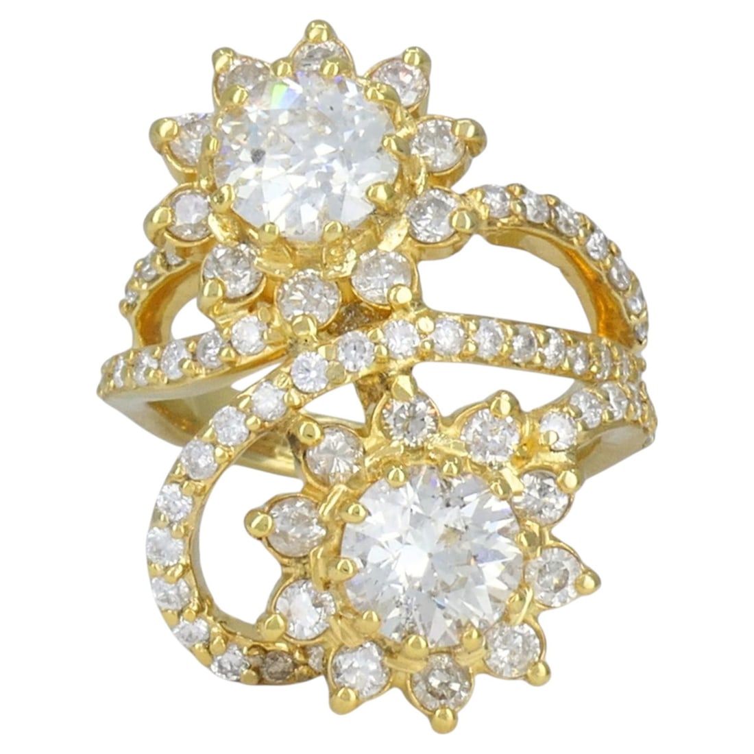 18k Yellow Gold Floral Diamond Cocktail Ring Bypass Design: 18k Yellow Gold Floral Diamond Cocktail Ring Bypass Design Vintage cocktail ring crafted in 18k yellow gold with a floral bypass design and diamond accents. The ring features a dimensional double flow