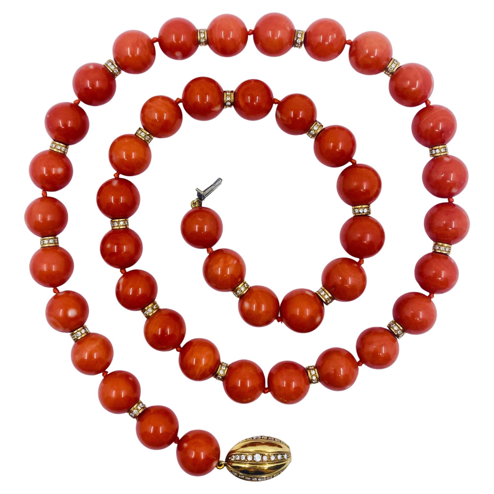 Bulgari Coral Bead Necklace in 18K Yellow Gold with Diamonds: Bulgari Coral Bead Necklace in 18K Yellow Gold with Diamonds A Bulgari necklace from the 1980s, crafted in 18k yellow gold with coral and diamond accents. The design features glossy coral beads altern