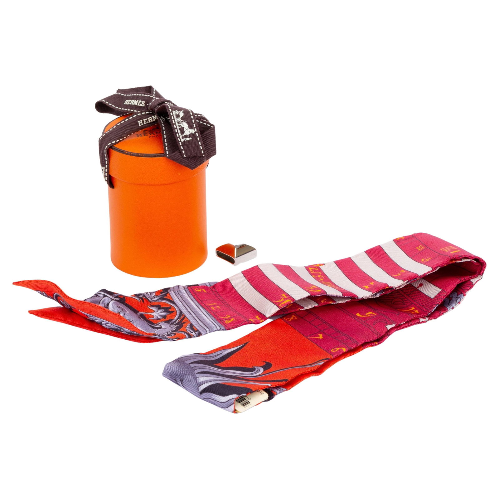Hermes Astrologie Red Silk Twilly Scarf with Scarf Ring: Hermes Astrologie Red Silk Twilly Scarf with Scarf Ring Introducing the Hermes Astrologie Twilly, an exquisite silk scarf designed by the renowned brand Hermes. This vibrant scarf features a striking 