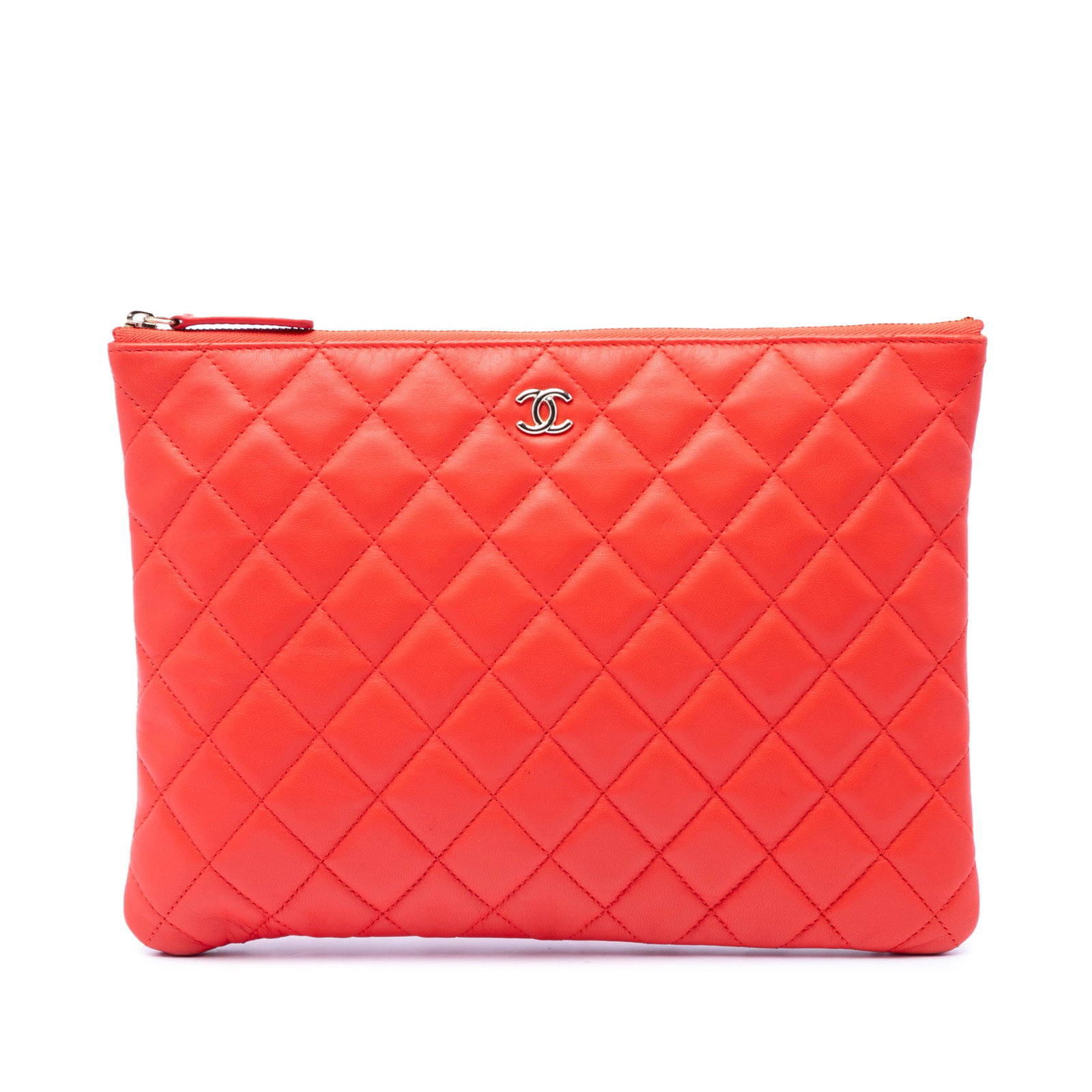 Chanel O Case medium orange quilted lambskin clutch: Chanel O Case medium orange quilted lambskin clutch Quilted lambskin leather clutch with a top zip closure, exterior slip pocket, and interior zip pocket. Includes dust bag and card. Condition AB with