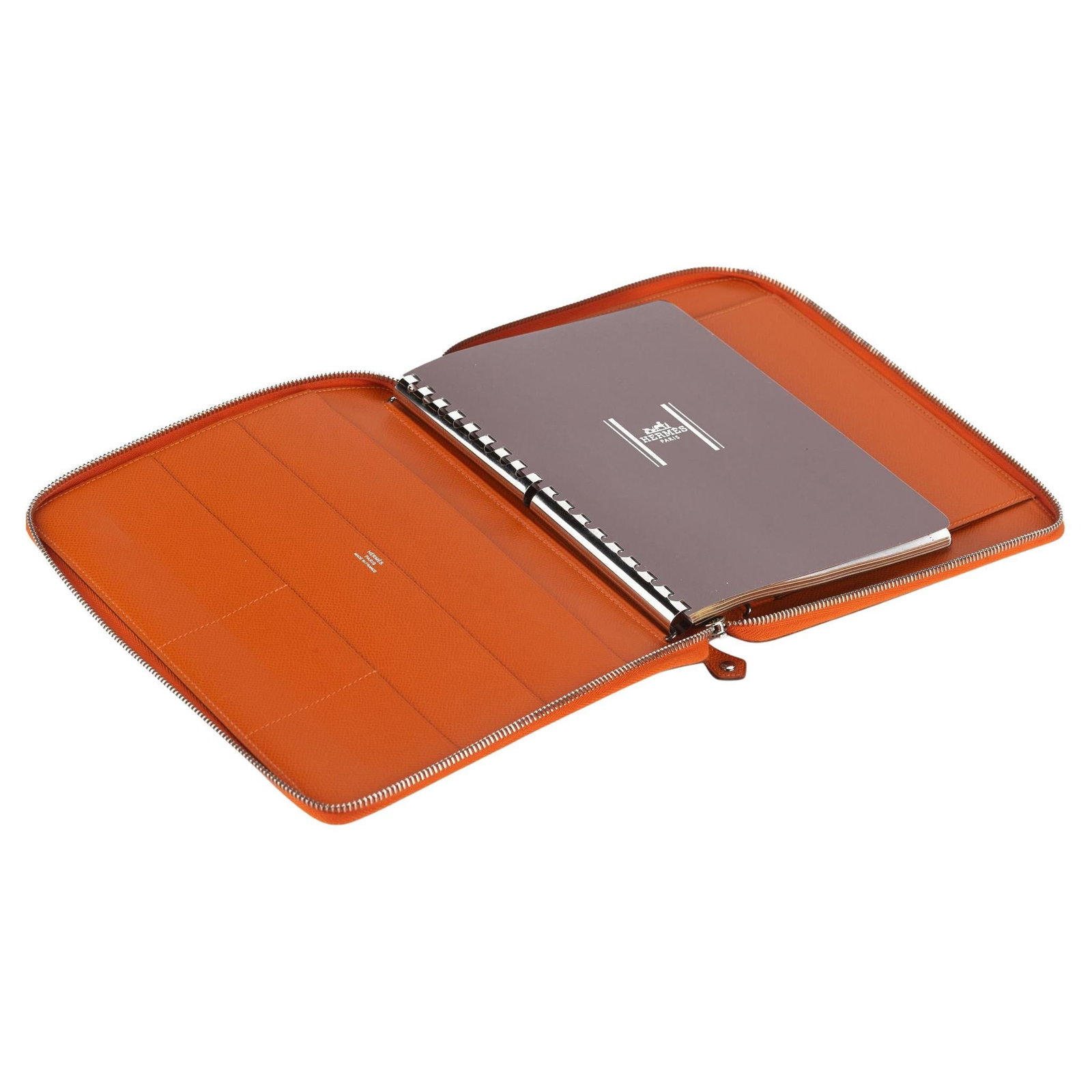 Hermes Epsom E-Zip Orange Calfskin iPad Notebook Cover: Hermes Epsom E-Zip Orange Calfskin iPad Notebook Cover Introducing the Hermes Epsom E-Zip iPad Notebook Cover, an exquisite accessory that combines style and functionality. Crafted from premium calfsk