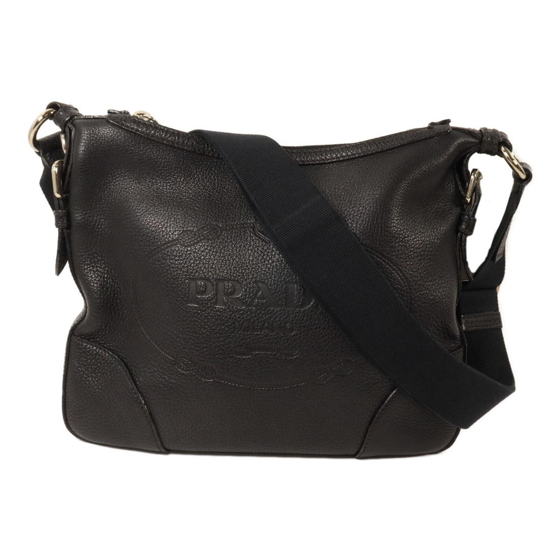PRADA calfskin shoulder bag in black with silver tone hardware: PRADA calfskin shoulder bag in black with silver tone hardware Black Prada shoulder bag crafted from calfskin leather. This unisex bag features a slim profile with an interior zip pocket and an adjust