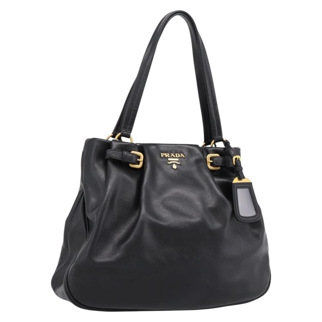 PRADA Black Leather Tote Bag with Dust Bag Name Tag Card: PRADA Black Leather Tote Bag with Dust Bag Name Tag Card Prada tote bag in black leather with gold-tone accents. Made in Italy, this women's tote includes a dust bag, name tag, and guarantee card. Con