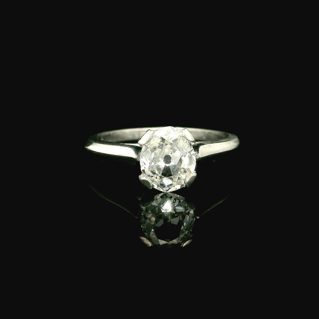 Antique Platinum 0.88ct Old Mine Cut Diamond Solitaire Ring: Antique Platinum 0.88ct Old Mine Cut Diamond Solitaire Ring This exquisite antique engagement ring features a stunning 0.88ctw Old Mine Cushion Cut diamond, showcasing its natural beauty with a clarit