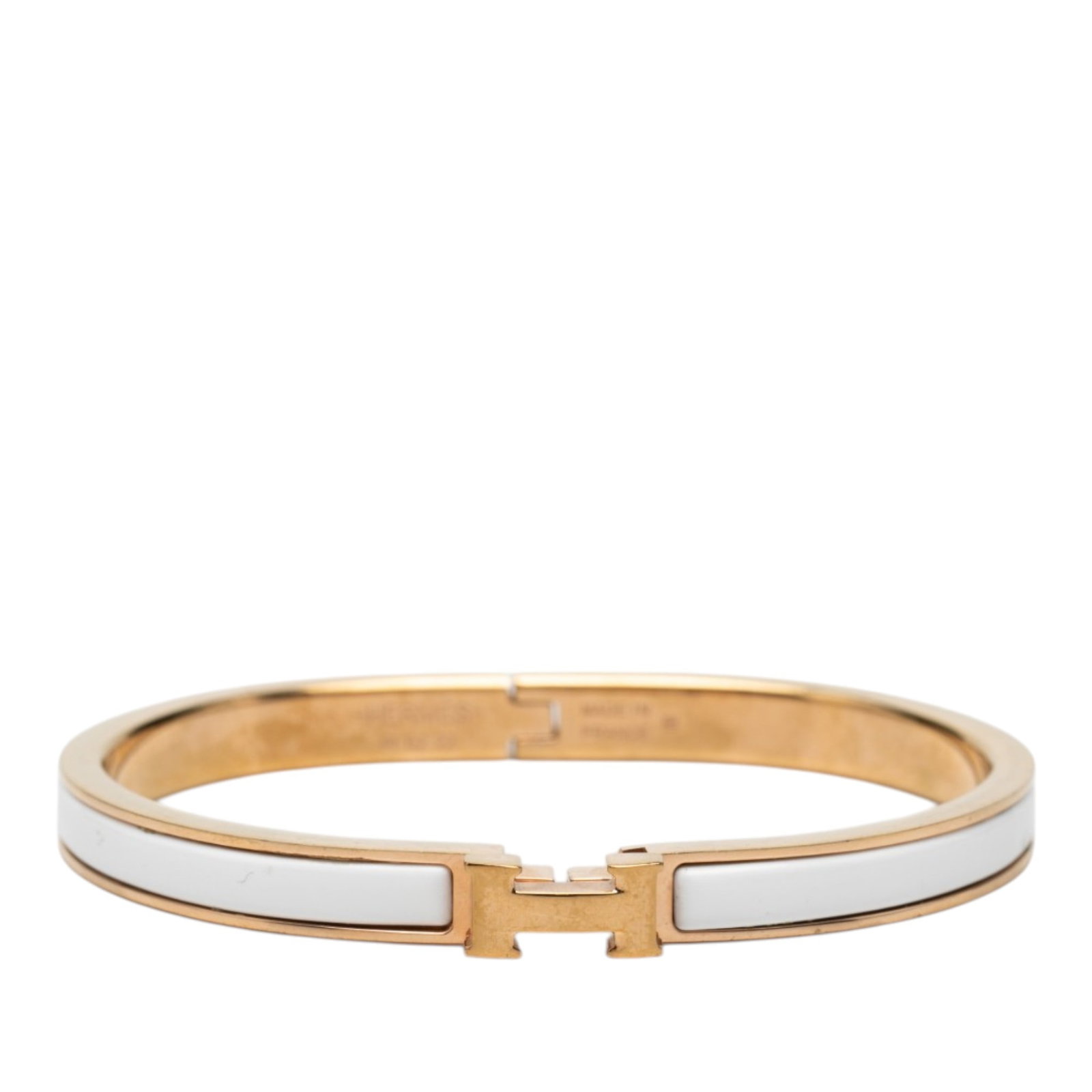 Hermes Clic H PM extra narrow enamel bracelet: Hermes Clic H PM extra narrow enamel bracelet Hermes Extra Narrow Enamel Clic H Bracelet PM with an enamel body and gold-plated metal hardware. This bracelet is made in France and features a metal cla