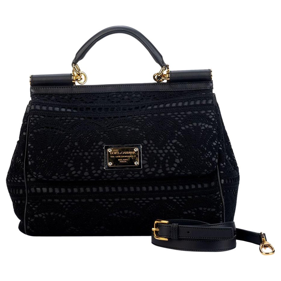 Dolce & Gabbana Large Black Macrame Bag with Strap: Dolce & Gabbana Large Black Macrame Bag with Strap This exquisite Dolce & Gabbana black macrame' bag showcases the brand's signature design and craftsmanship. Made in Italy, this large bag features a 