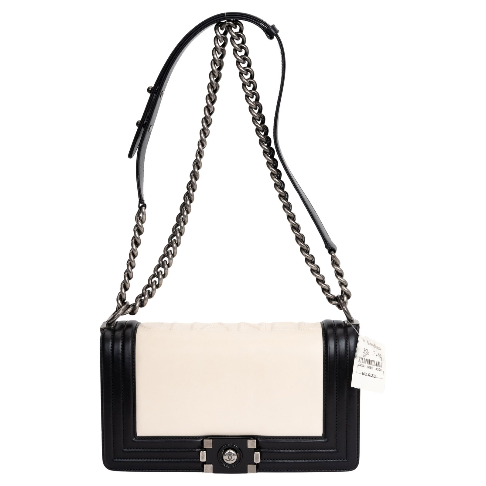 Chanel Boy Flap Bag Two-Tone Glazed Calfskin Collection 15: Chanel Boy Flap Bag Two-Tone Glazed Calfskin Collection 15 This stunning Chanel Boy Flap Bag showcases a contemporary two-tone design crafted from smooth glazed calfskin in classic Black and White. It