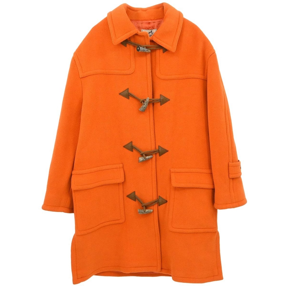 Hermes Orange Wool Toggle Coat Size 48 Made in France: Hermes Orange Wool Toggle Coat Size 48 Made in France Vintage Hermes long coat in orange wool with a toggle closure and long sleeves. This women's coat is made in France and features two exterior pock
