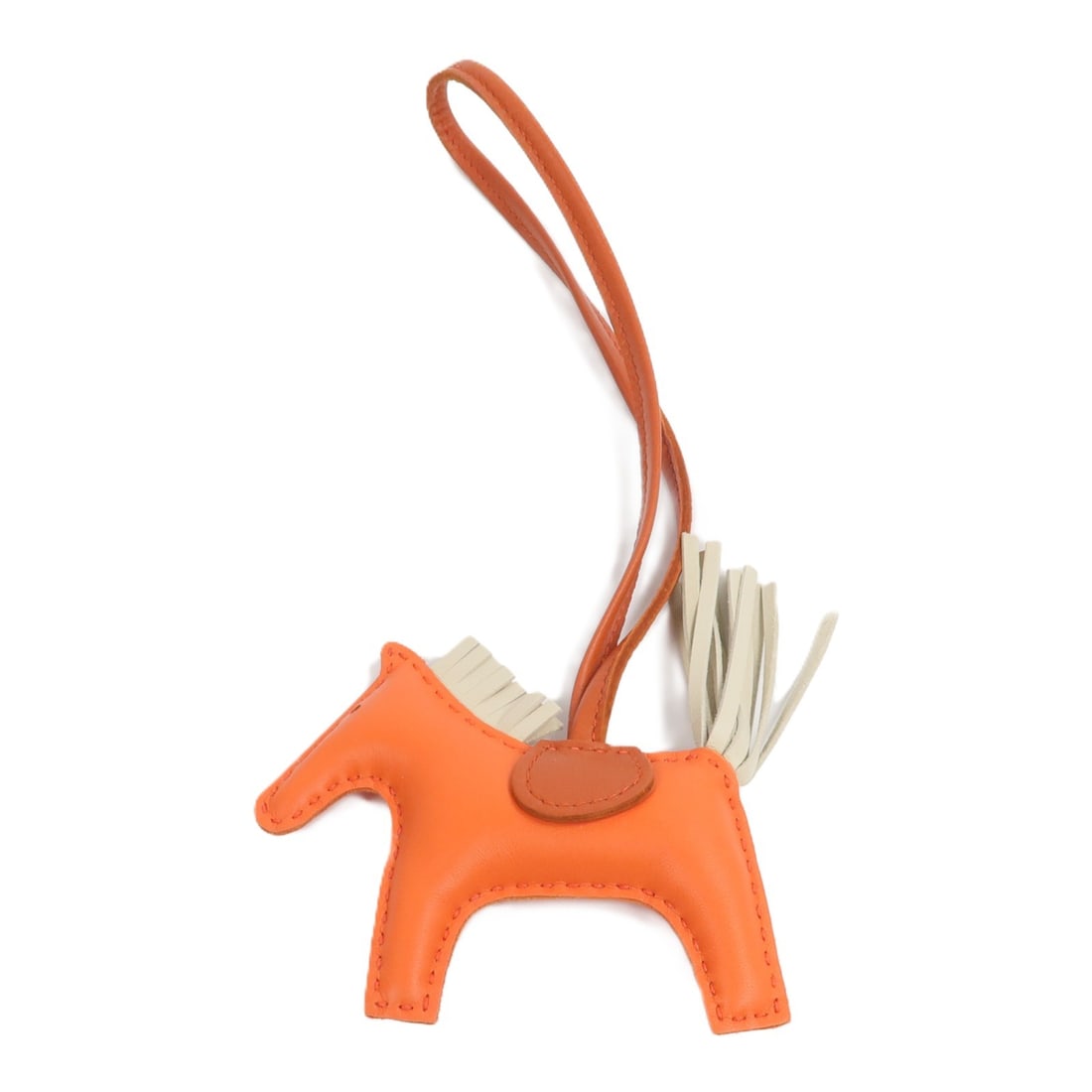 Hermes Rodeo PM bag charm in Milo Swift leather: Hermes Rodeo PM bag charm in Milo Swift leather Hermes Rodeo PM charm crafted in Milo/Swift leather with a playful multicolor design in Orange Poppy, Craie, and Cornalin. Made in France, this unisex c