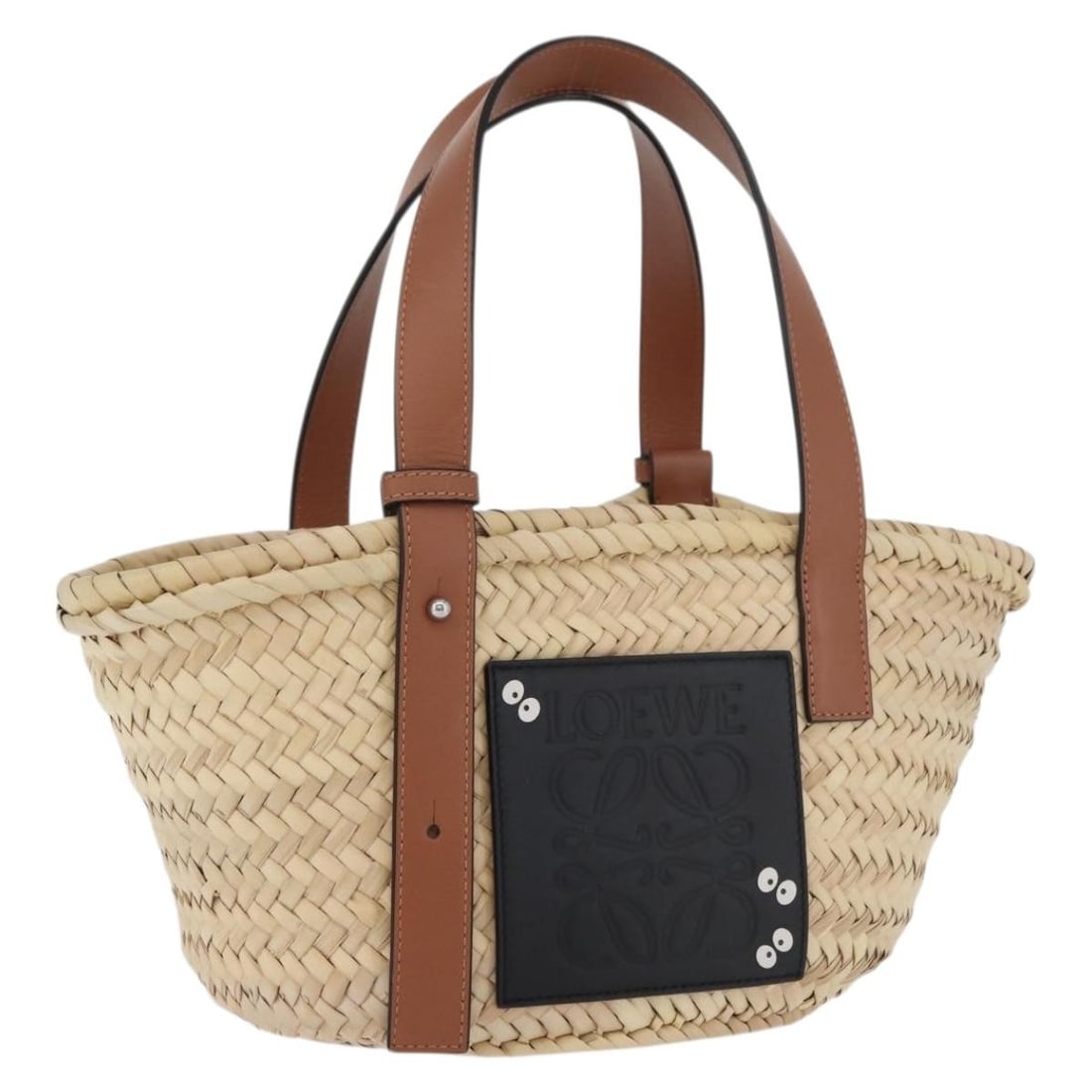 LOEWE My Neighbor Totoro Raffia Basket Hand Bag Beige: LOEWE My Neighbor Totoro Raffia Basket Hand Bag Beige LOEWE x Ghibli My Neighbor Totoro basket handbag in beige with Soot Sprites design. This women's handbag comes with a dust bag and is made in Spai