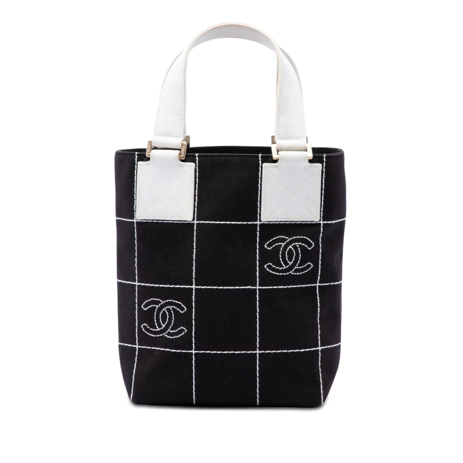 Chanel Small CC Chocolate Bar Tote Bag in Black Canvas: Chanel Small CC Chocolate Bar Tote Bag in Black Canvas Chanel Small CC Chocolate Bar Canvas Tote in black fabric with flat canvas handles, an open top with magnetic snap button closure, and an interio