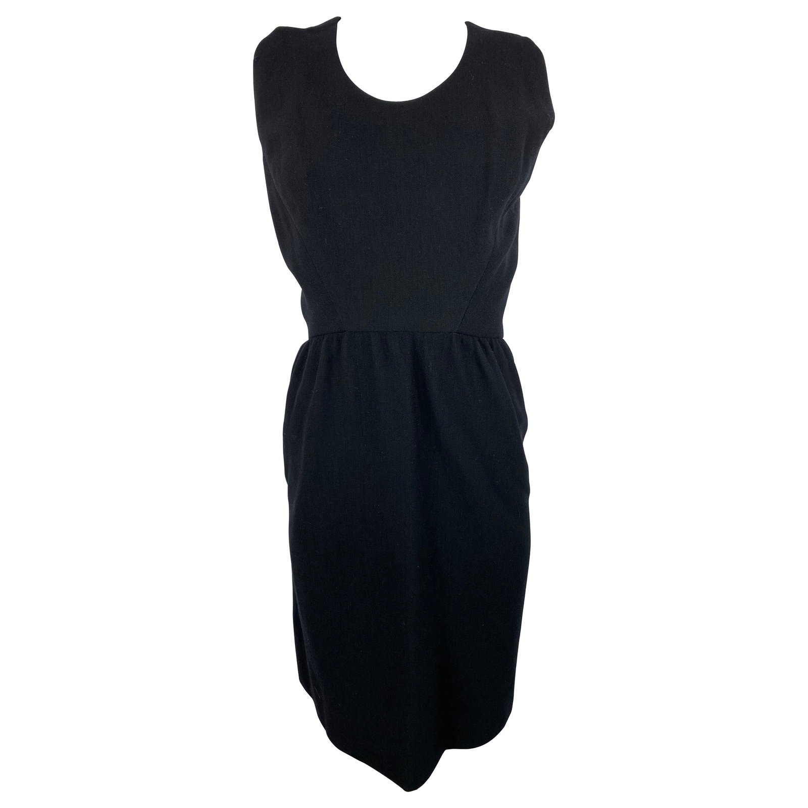 Galanos wrap style black mini dress with crew neckline: Galanos wrap style black mini dress with crew neckline A black mini dress by Galanos, featuring a crew neckline, wrap-style design, side zipper closure, and waist hooks at the back wrap. The dress is 